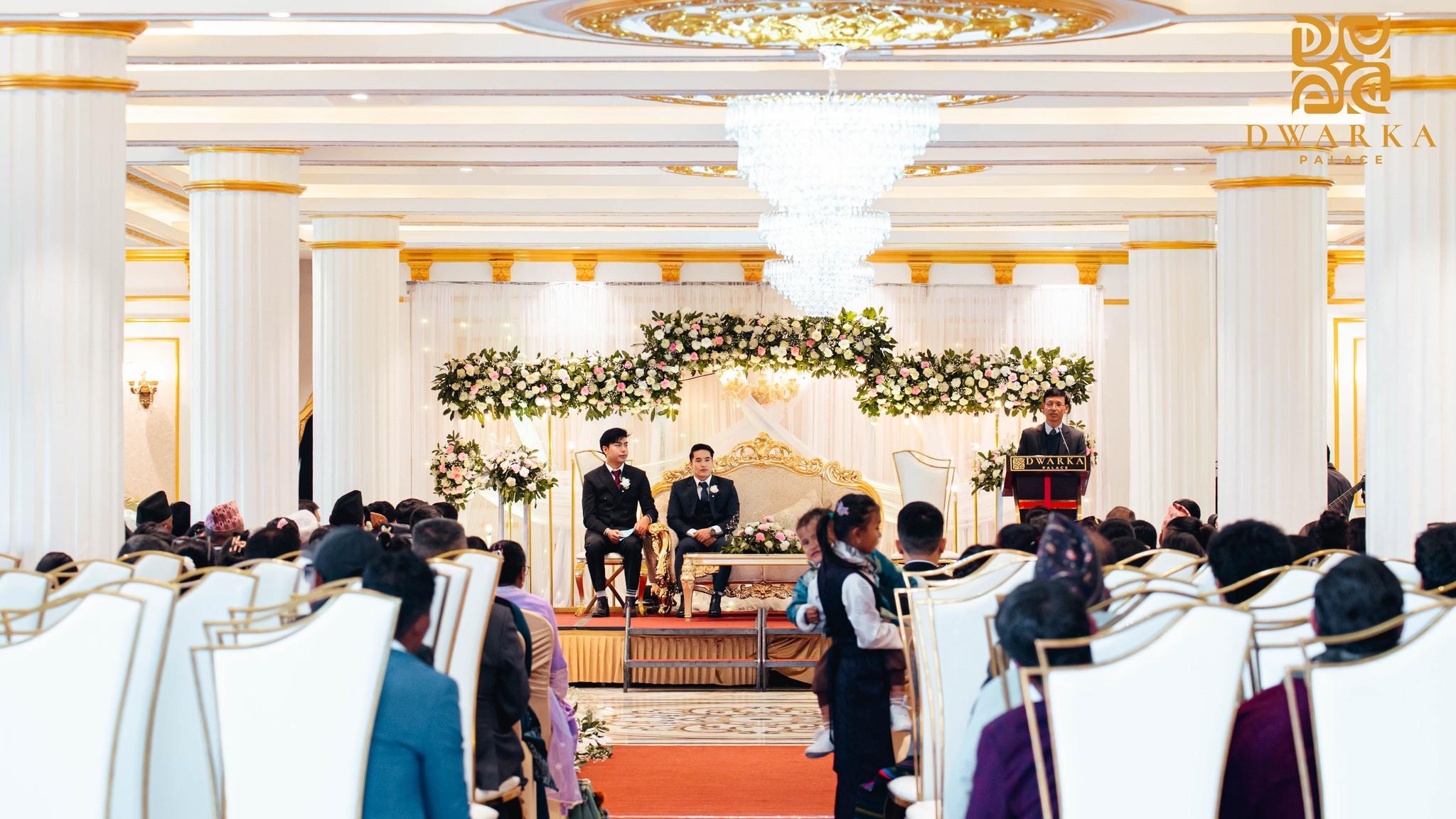 Guests have a dinner at the hall.